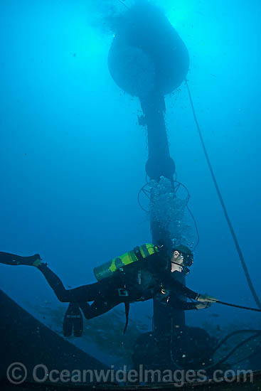 Diver working on Wave Energy Buoy photo