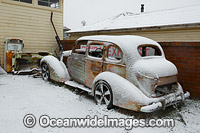 Old car cloaked in snow. Guyra, New England Tableland, New South Wales, Australia.